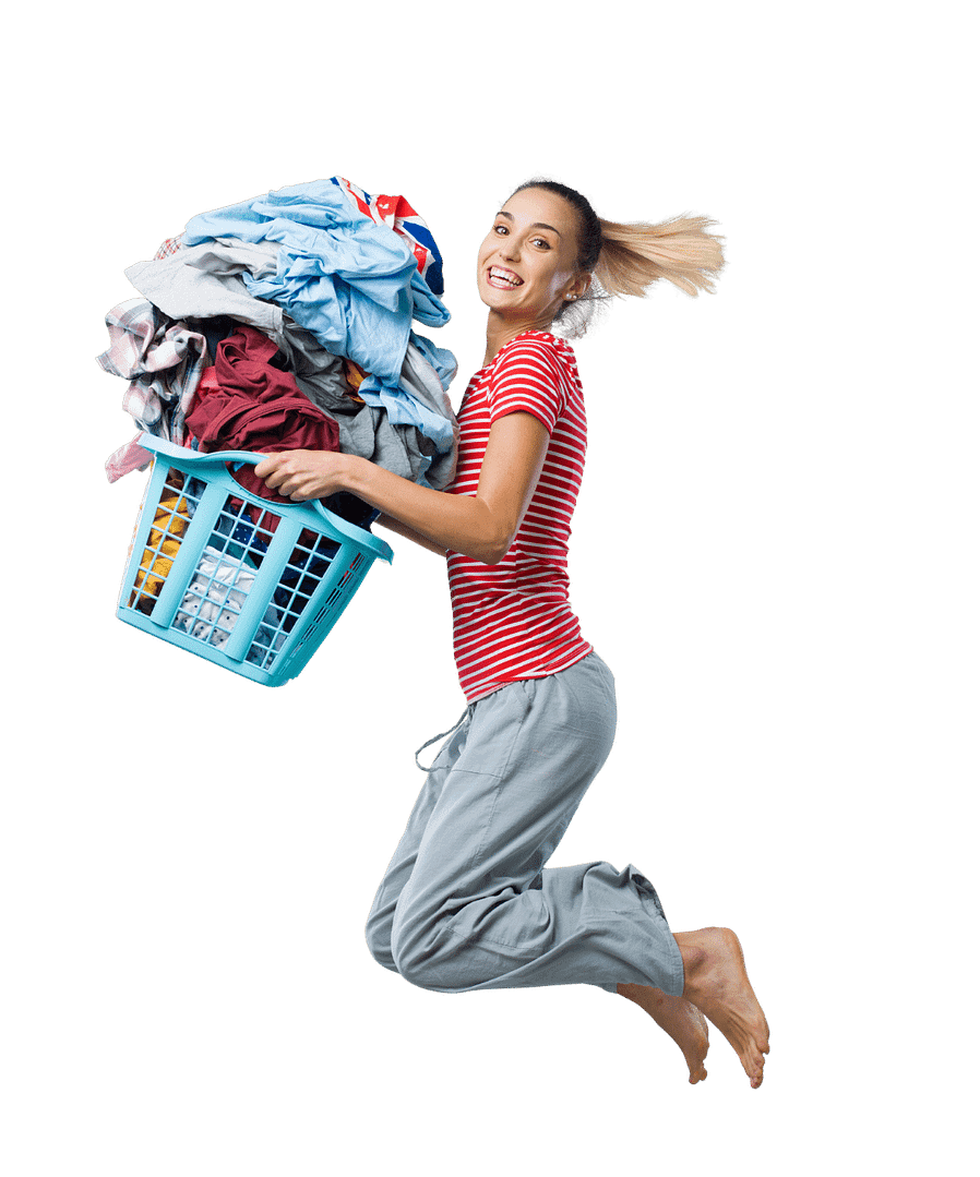Woman in pajamas with laundry basket jumping in the air smiling
