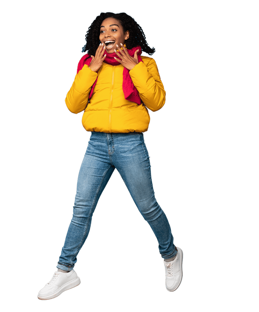 Woman with yellow jacket and red scarf jumping with surprised look on her face and smile