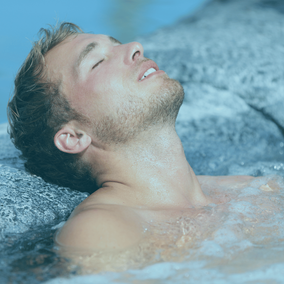 Guy relaxing in tub